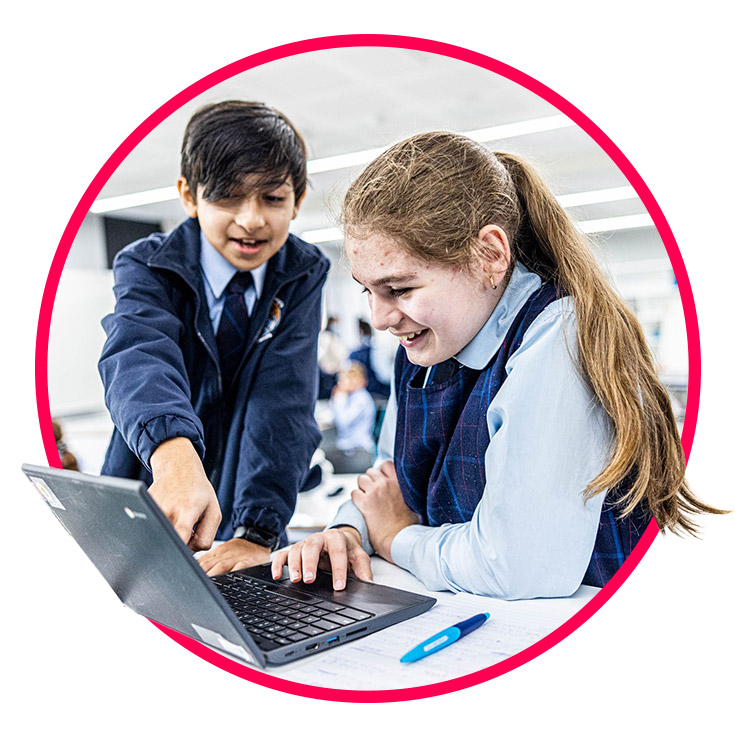 Boy and girls learning on laptop at St Margaret Mary's Catholic Primary Merrylands